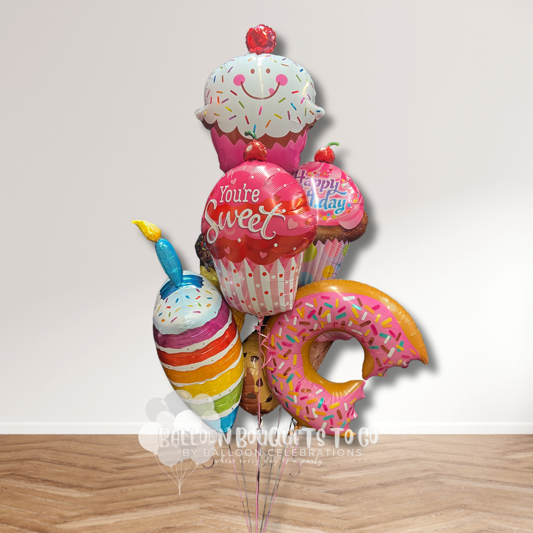 Birthday balloon bouquet with smiling cupcake you're sweet rainbow cake cookie and donut